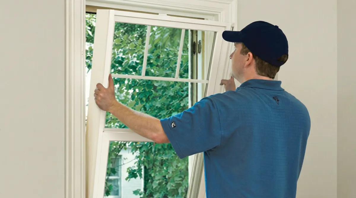 Professional contractors performing a residential window insulation and replacement service in Long Beach, CA
